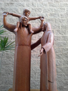 Statue of the Holy Family with Jesus on St. Joseph's shoulders