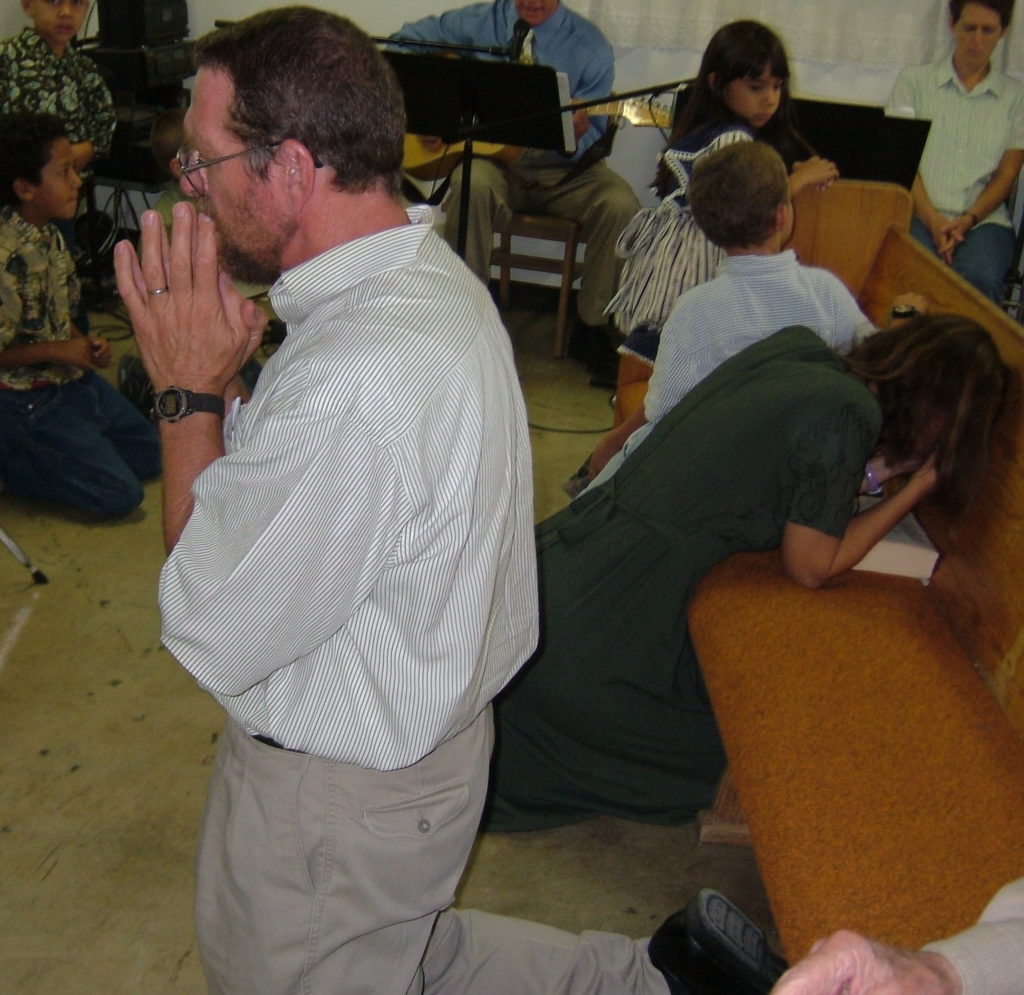 people praying at Mass