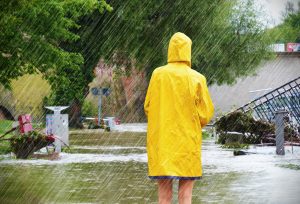 Woman standing in a flooded street