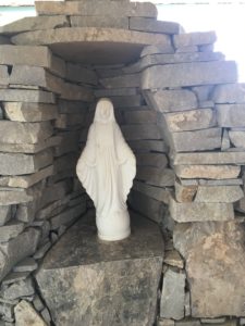 Statue of the Blessed Mother in rock enclosure 